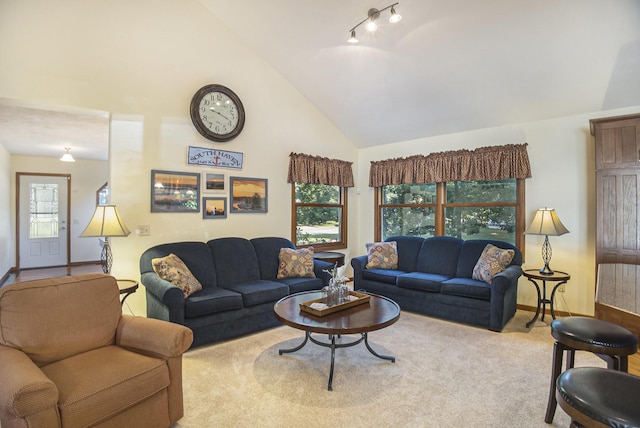 220 Park Ave, South Haven, MI 49090 - carpeted living room with high vaulted ceiling and baseboards