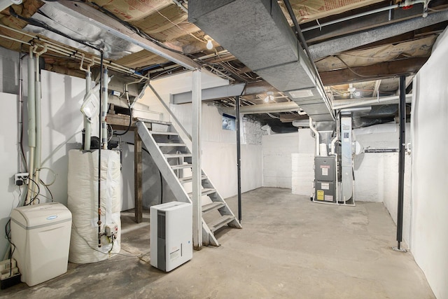 144 E Hickory Rd, Battle Creek, MI 49017 - unfinished basement featuring stairs, water heater, heating unit, and a water softener system