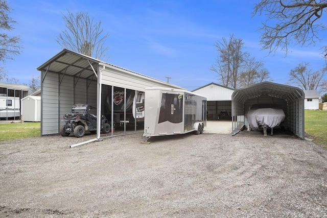 144 E Hickory Rd, Battle Creek, MI 49017 - back of house featuring a carport and driveway