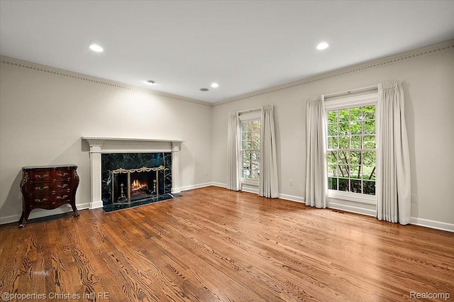 400 Hamilton Rd, Bloomfield, MI 48301 - unfurnished living room with a high end fireplace, wood finished floors, recessed lighting, and crown molding
