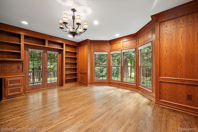 400 Hamilton Rd, Bloomfield, MI 48301 - spare room featuring a chandelier, built in shelves, wood finished floors, recessed lighting, and wooden walls