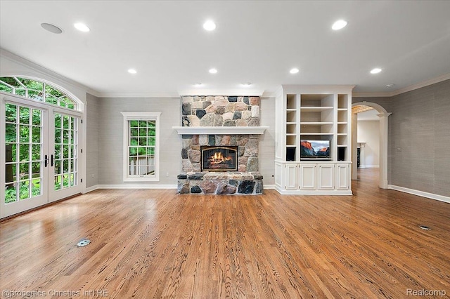 400 Hamilton Rd, Bloomfield, MI 48301 - unfurnished living room with ornamental molding, a fireplace, recessed lighting, wood finished floors, and arched walkways