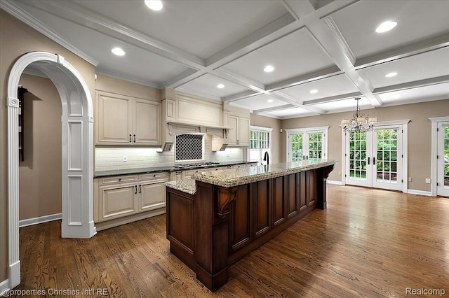 400 Hamilton Rd, Bloomfield, MI 48301 - kitchen with french doors, dark wood finished floors, backsplash, light stone counters, and beam ceiling