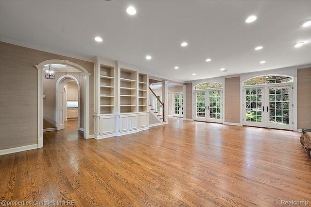 400 Hamilton Rd, Bloomfield, MI 48301 - unfurnished living room featuring recessed lighting, french doors, ornamental molding, light wood-type flooring, and stairs