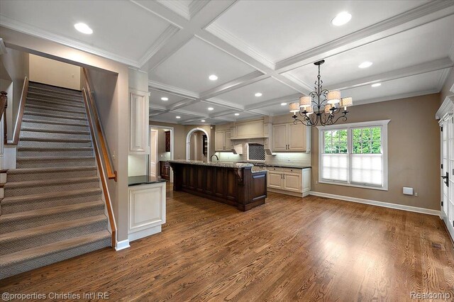 400 Hamilton Rd, Bloomfield, MI 48301 - kitchen with coffered ceiling, dark wood finished floors, a chandelier, a breakfast bar area, and beamed ceiling