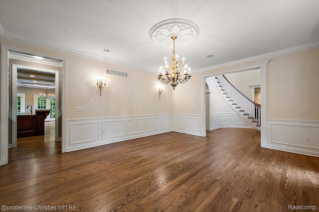 400 Hamilton Rd, Bloomfield, MI 48301 - unfurnished dining area with a chandelier, crown molding, stairs, dark wood-style floors, and a wainscoted wall