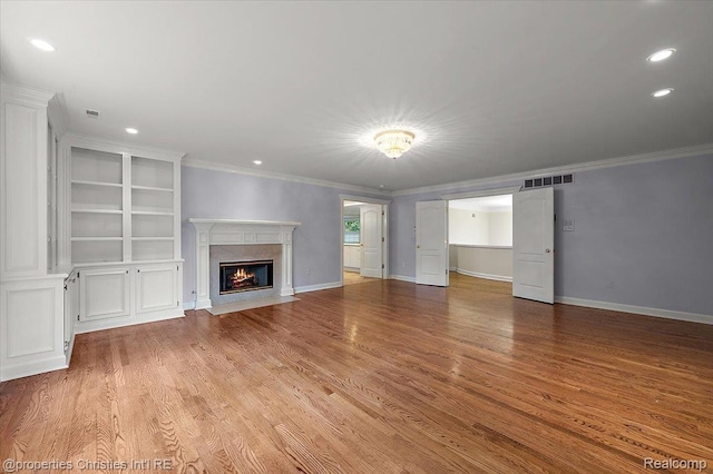 400 Hamilton Rd, Bloomfield, MI 48301 - unfurnished living room featuring ornamental molding, a fireplace, light wood finished floors, and recessed lighting
