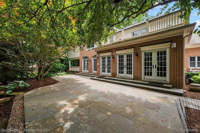 400 Hamilton Rd, Bloomfield, MI 48301 - rear view of house with french doors, brick siding, and a patio area