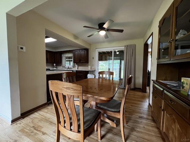 2682 Elmwood Dr, Adrian, MI 49221 - dining room with light wood finished floors and ceiling fan