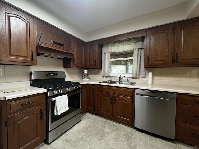 2682 Elmwood Dr, Adrian, MI 49221 - kitchen featuring appliances with stainless steel finishes, light countertops, and tasteful backsplash