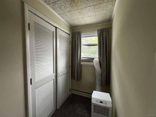 2682 Elmwood Dr, Adrian, MI 49221 - hallway with a baseboard radiator and dark colored carpet