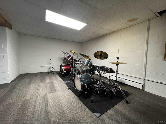 2682 Elmwood Dr, Adrian, MI 49221 - playroom with carpet, concrete block wall, and a baseboard heating unit