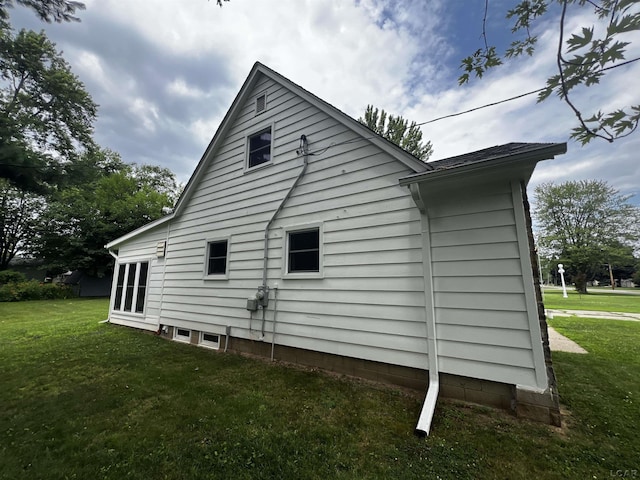 2682 Elmwood Dr, Adrian, MI 49221 - view of home's exterior with a lawn