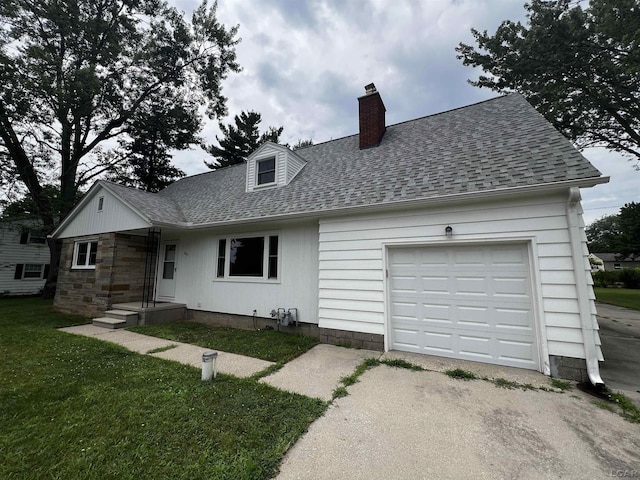 2682 Elmwood Dr, Adrian, MI 49221 - view of front of house featuring roof with shingles, an attached garage, driveway, a chimney, and a front yard