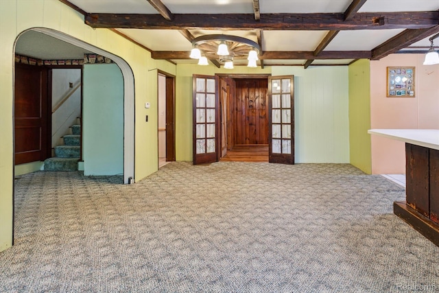 4415 Central St, Columbiaville, MI 48421 - entrance foyer featuring carpet, beam ceiling, stairs, arched walkways, and coffered ceiling