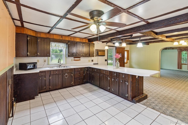 4415 Central St, Columbiaville, MI 48421 - kitchen with coffered ceiling, light countertops, a peninsula, ceiling fan, and light carpet