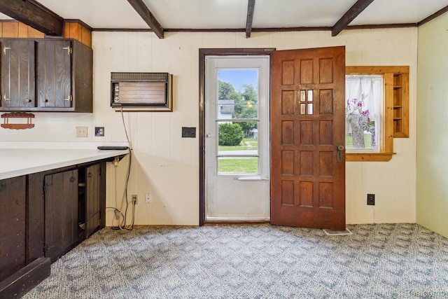4415 Central St, Columbiaville, MI 48421 - kitchen featuring beamed ceiling, healthy amount of natural light, carpet flooring, a wall mounted air conditioner, and wood walls