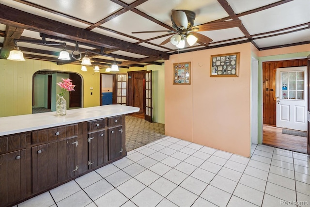4415 Central St, Columbiaville, MI 48421 - kitchen with ceiling fan, light countertops, dark brown cabinets, coffered ceiling, and beamed ceiling