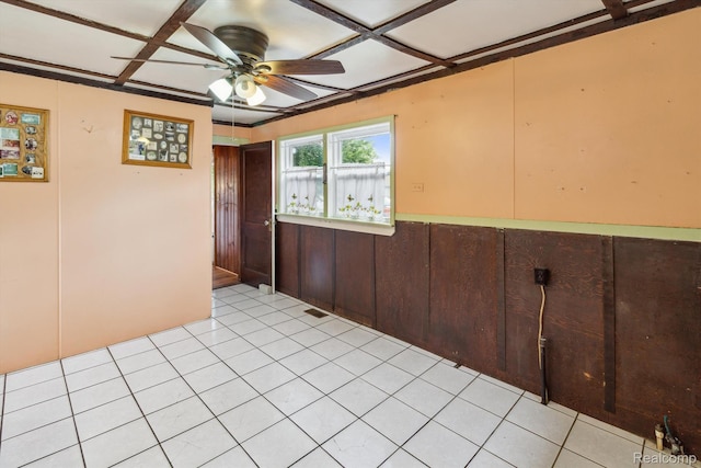 4415 Central St, Columbiaville, MI 48421 - spare room featuring ceiling fan, a wainscoted wall, coffered ceiling, and light tile patterned flooring