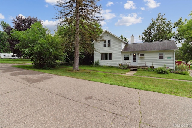 4415 Central St, Columbiaville, MI 48421 - traditional-style house with a chimney and a front lawn