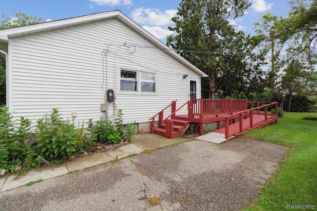 4415 Central St, Columbiaville, MI 48421 - back of property with a deck and a yard