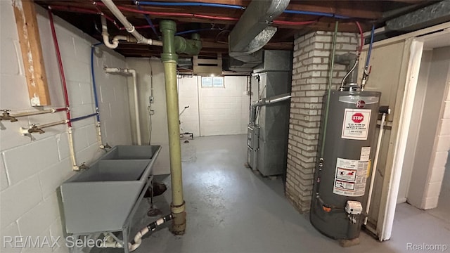 1902 Crestbrook Ln, Flint, MI 48507 - unfinished below grade area with gas water heater, concrete block wall, and heating unit