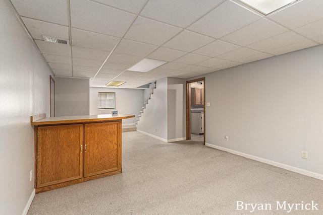 4675 44th St, Holland, MI 49423 - bar area featuring light carpet, a paneled ceiling, and stairs