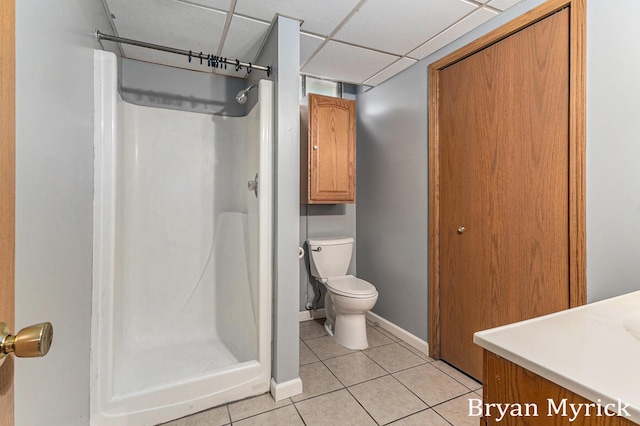 4675 44th St, Holland, MI 49423 - bathroom with a stall shower, tile patterned flooring, vanity, and a paneled ceiling