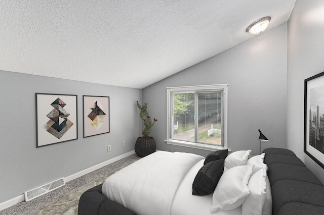 4675 44th St, Holland, MI 49423 - carpeted bedroom with vaulted ceiling and a textured ceiling
