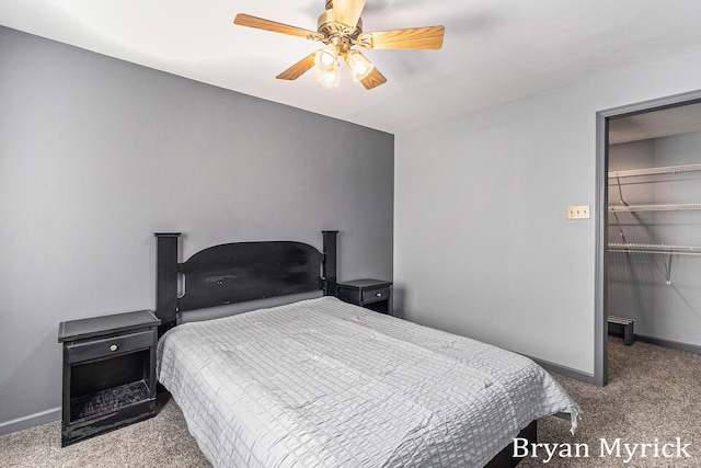 4675 44th St, Holland, MI 49423 - bedroom featuring carpet flooring, a spacious closet, and a ceiling fan