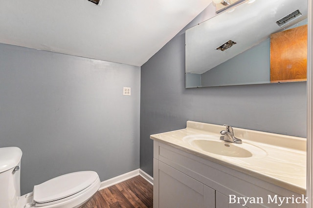 4675 44th St, Holland, MI 49423 - bathroom featuring lofted ceiling, vanity, and wood finished floors
