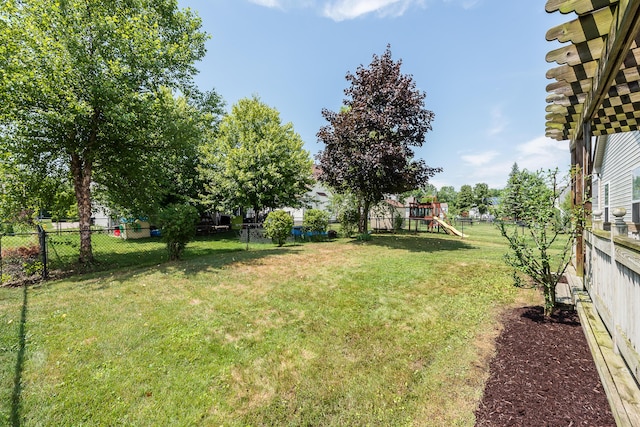 6602 Robindale Dr, Ypsilanti, MI 48197 - fenced backyard featuring a playground