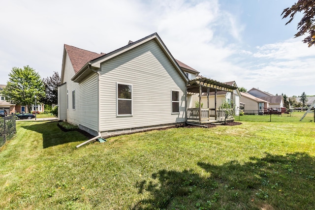 6602 Robindale Dr, Ypsilanti, MI 48197 - rear view of house featuring a pergola, a fenced backyard, and a wooden deck