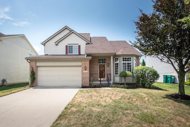 6602 Robindale Dr, Ypsilanti, MI 48197 - traditional home with concrete driveway, a front yard, a garage, brick siding, and roof with shingles