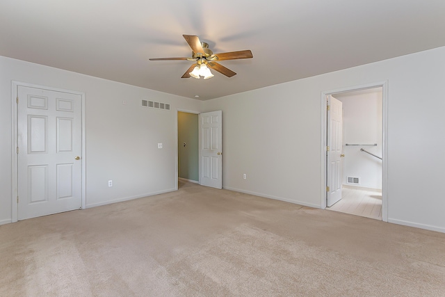 6602 Robindale Dr, Ypsilanti, MI 48197 - unfurnished bedroom featuring light colored carpet, ensuite bathroom, and a ceiling fan