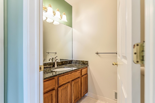 6602 Robindale Dr, Ypsilanti, MI 48197 - bathroom with vanity and tile patterned floors