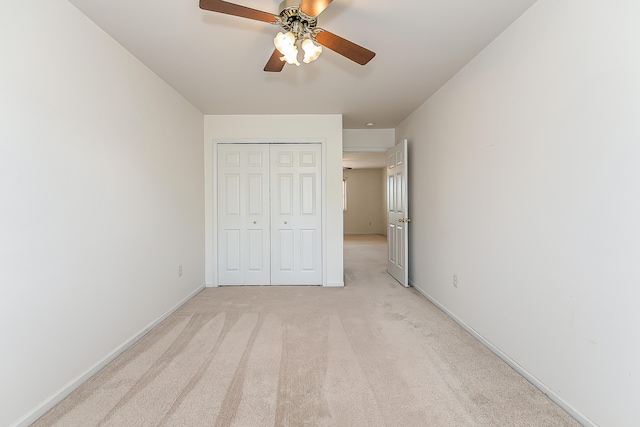 6602 Robindale Dr, Ypsilanti, MI 48197 - unfurnished bedroom with a closet, light colored carpet, and ceiling fan