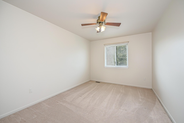 6602 Robindale Dr, Ypsilanti, MI 48197 - unfurnished room with light colored carpet and ceiling fan