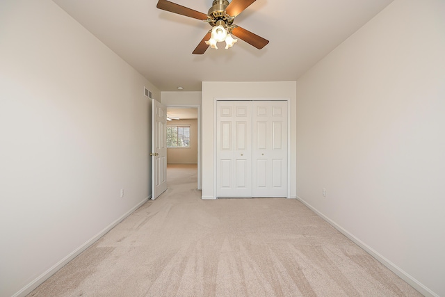 6602 Robindale Dr, Ypsilanti, MI 48197 - unfurnished bedroom featuring light colored carpet, a closet, and ceiling fan