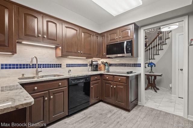 1109 Ivyglen Cir, Bloomfield Hills, MI 48304 - kitchen with black appliances, light stone countertops, decorative backsplash, and dark brown cabinetry