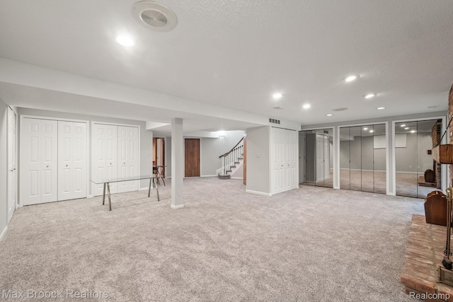 1109 Ivyglen Cir, Bloomfield Hills, MI 48304 - finished below grade area with stairway, light colored carpet, and recessed lighting