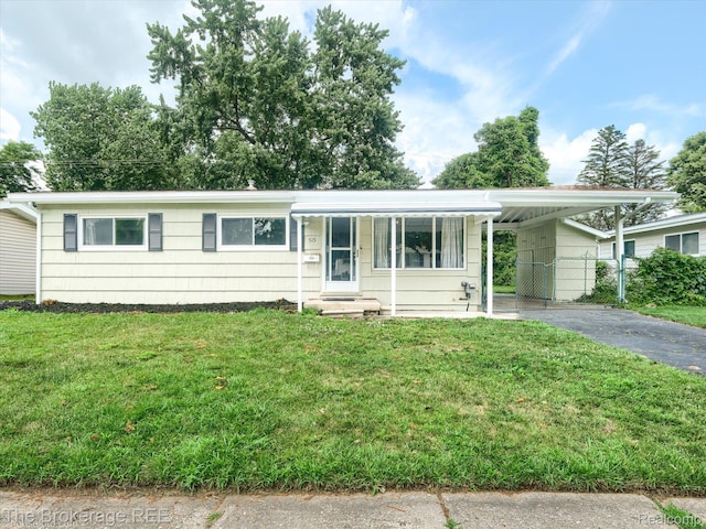 515 Juniper Dr, Davison, MI 48423 - ranch-style home with an attached carport and driveway