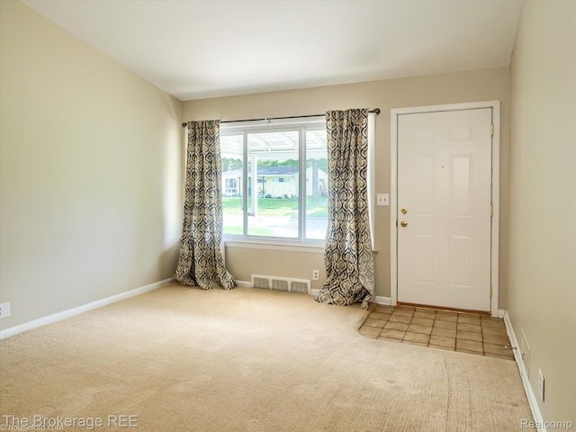 515 Juniper Dr, Davison, MI 48423 - carpeted entrance foyer featuring baseboards