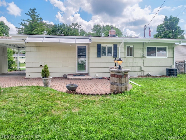 515 Juniper Dr, Davison, MI 48423 - back of property with a lawn and a chimney
