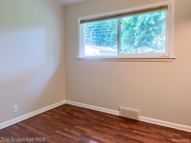 515 Juniper Dr, Davison, MI 48423 - empty room with dark wood finished floors and baseboards