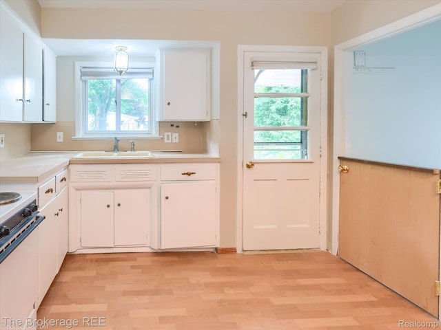 515 Juniper Dr, Davison, MI 48423 - kitchen with white electric range, light wood-type flooring, white cabinets, and light countertops