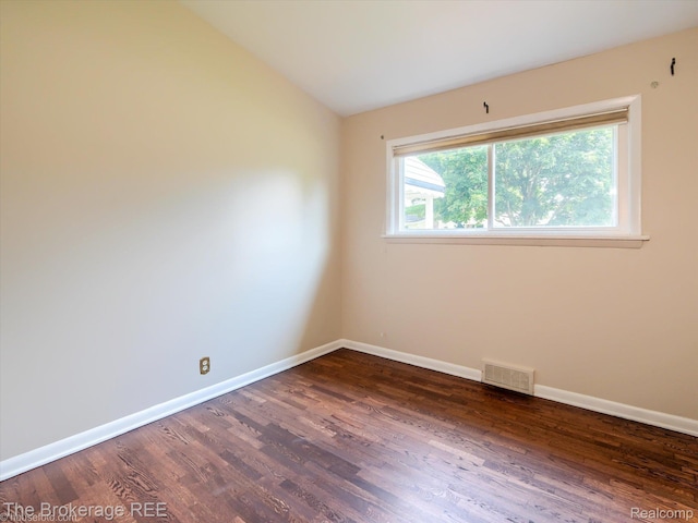 515 Juniper Dr, Davison, MI 48423 - unfurnished room with dark wood-style floors and lofted ceiling