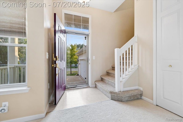 1145 York Ave, Howell, MI 48843 - foyer entrance featuring baseboards and stairway