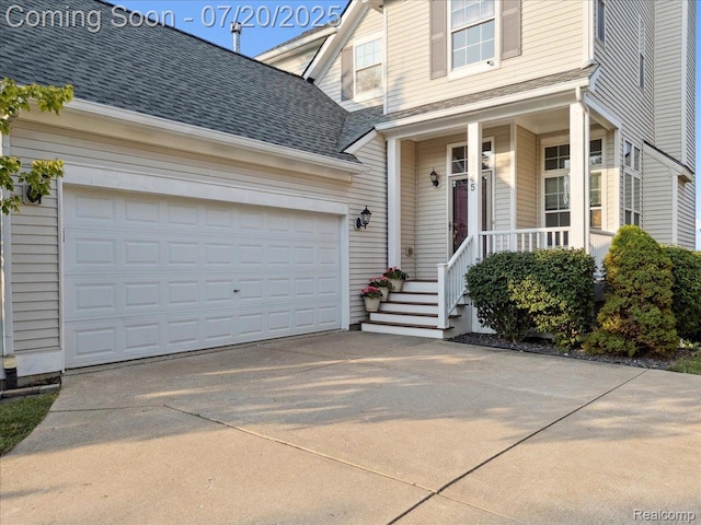 1145 York Ave, Howell, MI 48843 - view of front of home featuring driveway, an attached garage, and a shingled roof