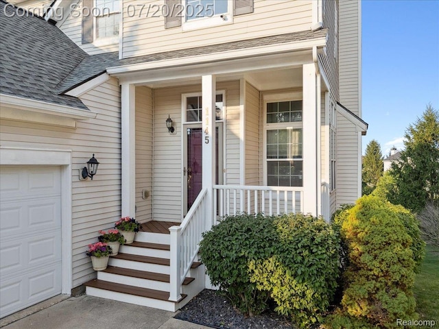 1145 York Ave, Howell, MI 48843 - property entrance featuring roof with shingles and covered porch